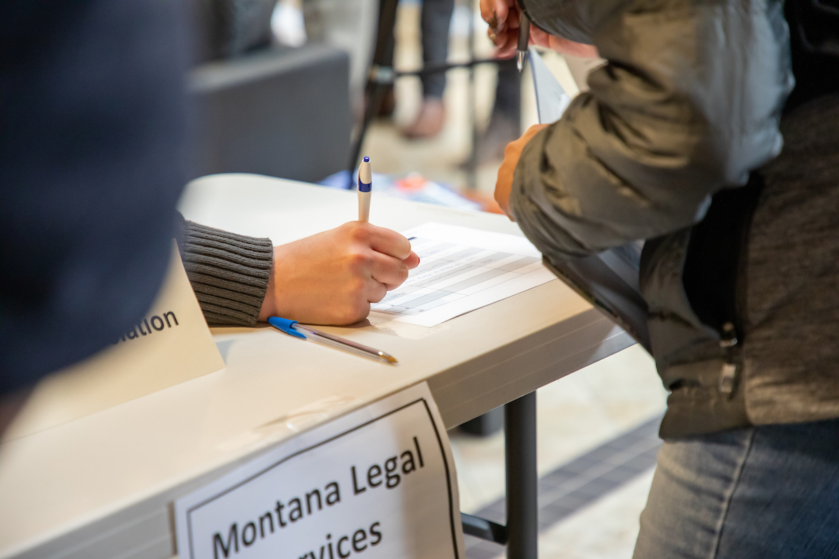 Person filling out legal services form