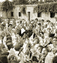 Photo of Louis Armstrong with children
