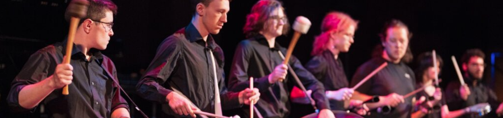 Image of students playing drums.