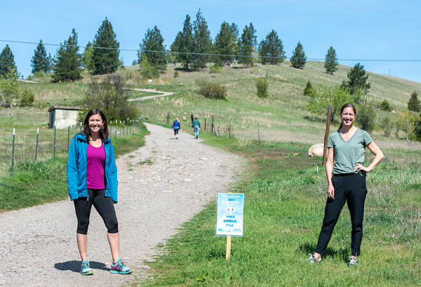 UM researchers Jennifer Thomsen and Libby Metcalf (right) stand at a Missoula trailhead
