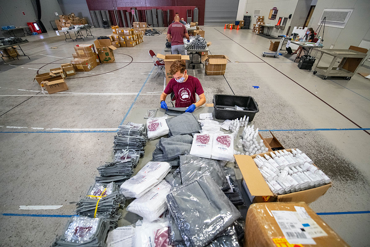 A student helps prepare Healthy Griz Kits at the University of Montana.