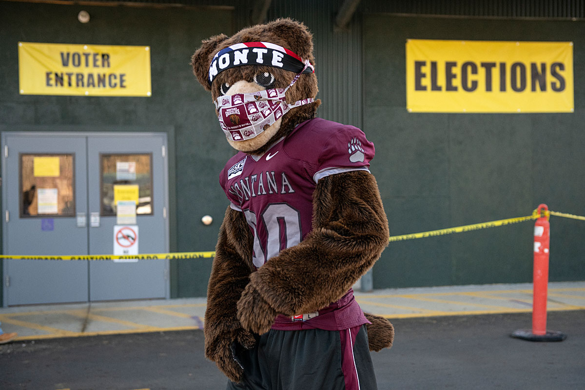 Monte the mascot stands outside a Missoula polling place.