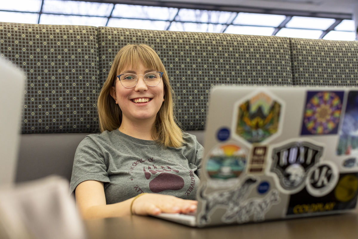 Photo of student sitting in front of laptop. 