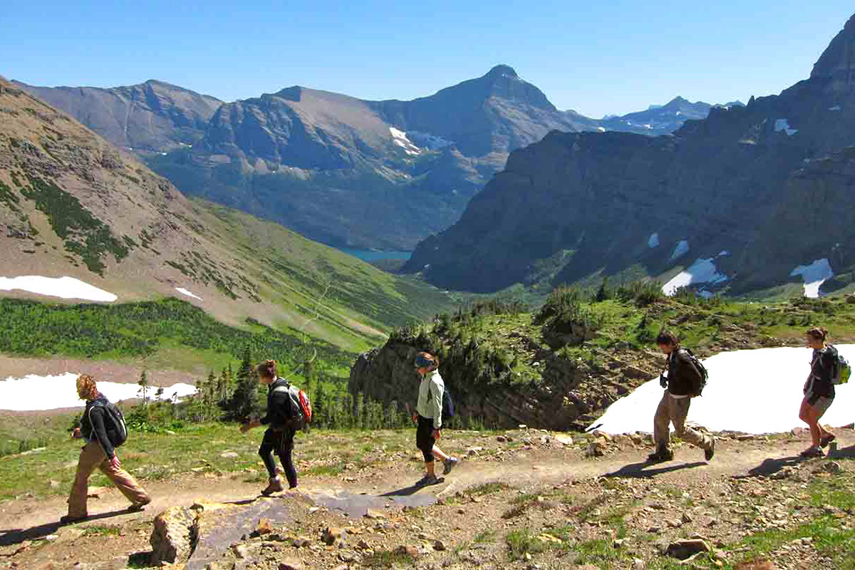 Students walk in Glacier National Park.