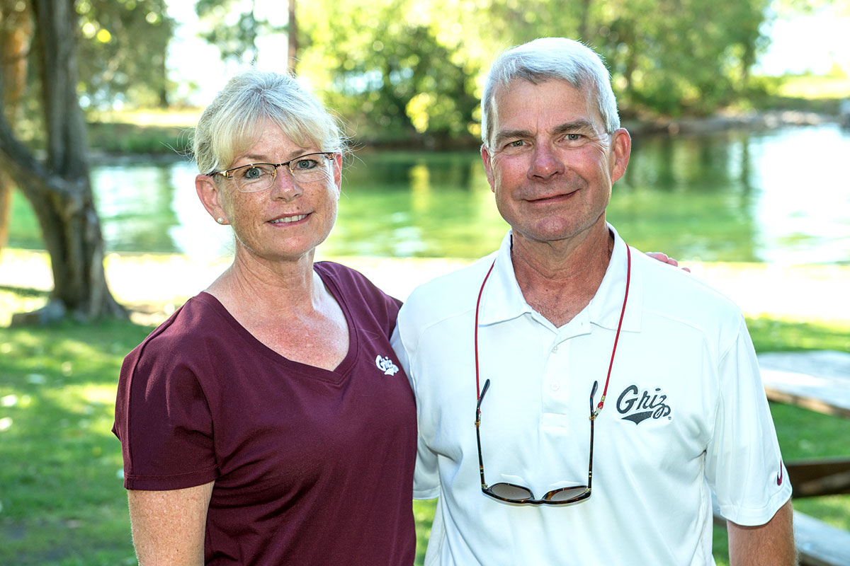 Mary Olson and her husband, Greg, in Griz Gear.