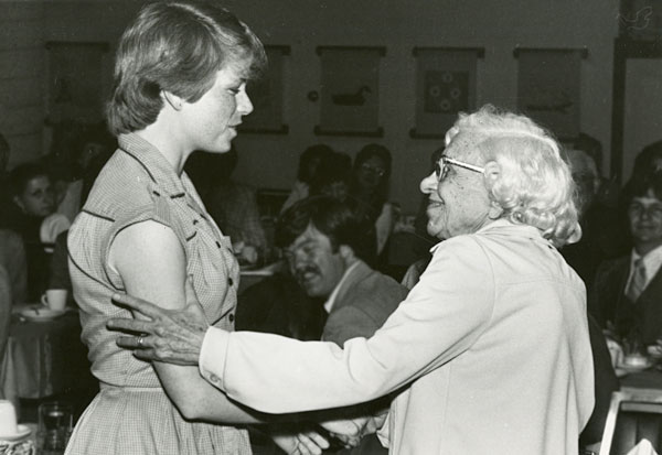 Mary Olson (left) receives the Albert Helbing Memorial Scholarship as a UM undergraduate.
