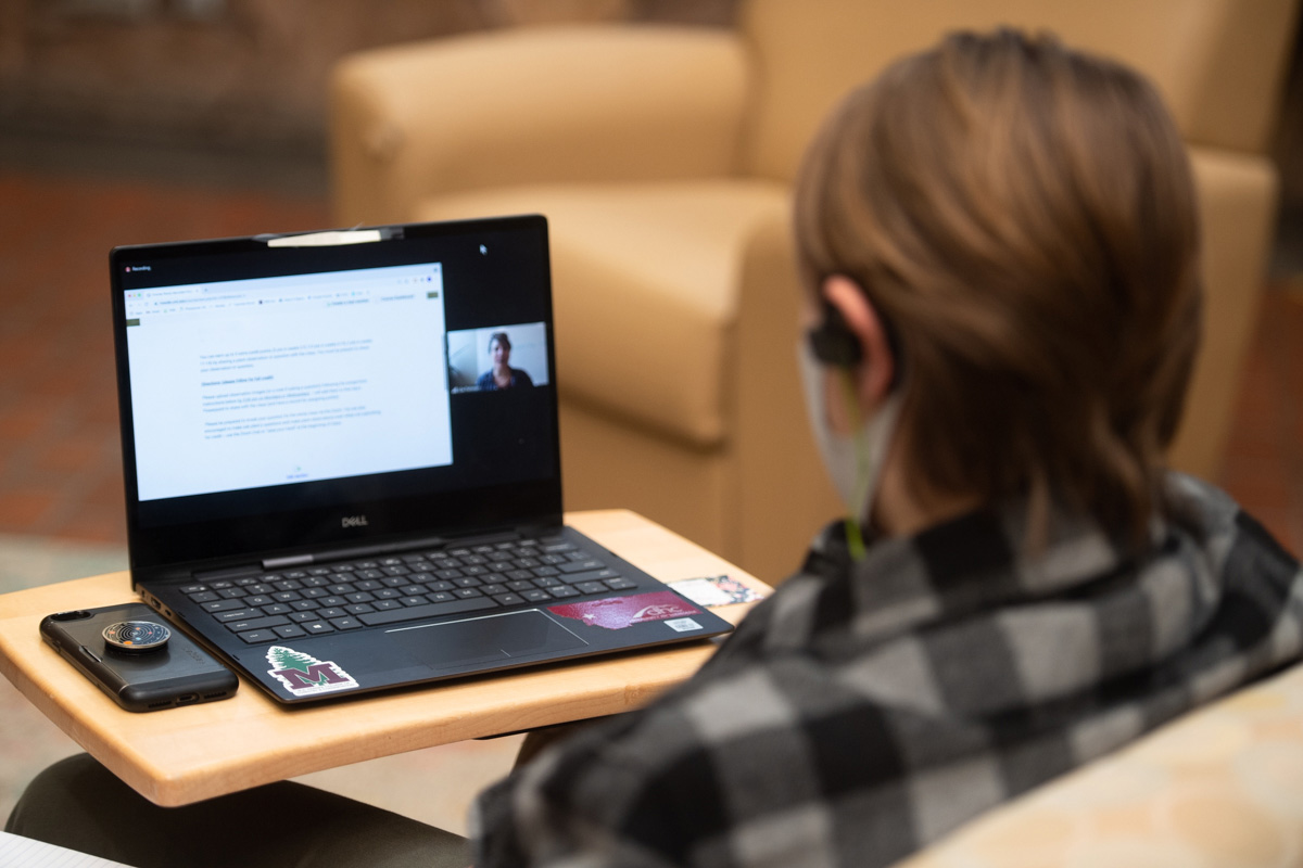 Student sitting at a laptop