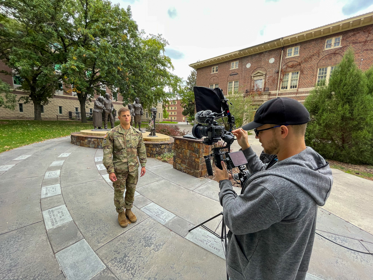Members of an Amazon film crew direct student Nate LaCorte as he shares his experiences as a UM student during filming for "The College Tour."