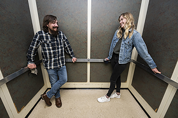 Photo of Sam and Morgan in the Jesse Hall elevator