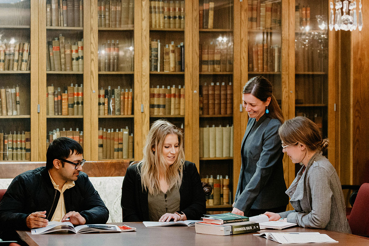 Sara Rinfret, director of UM’s Department of Public Administration and Policy, works with students.