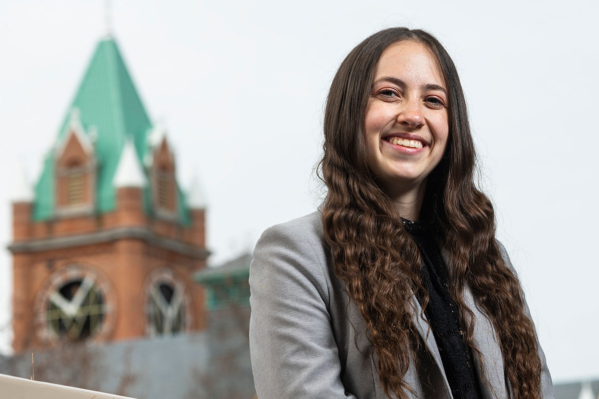 A picture of Hunter Grimes with Main Hall in the background.