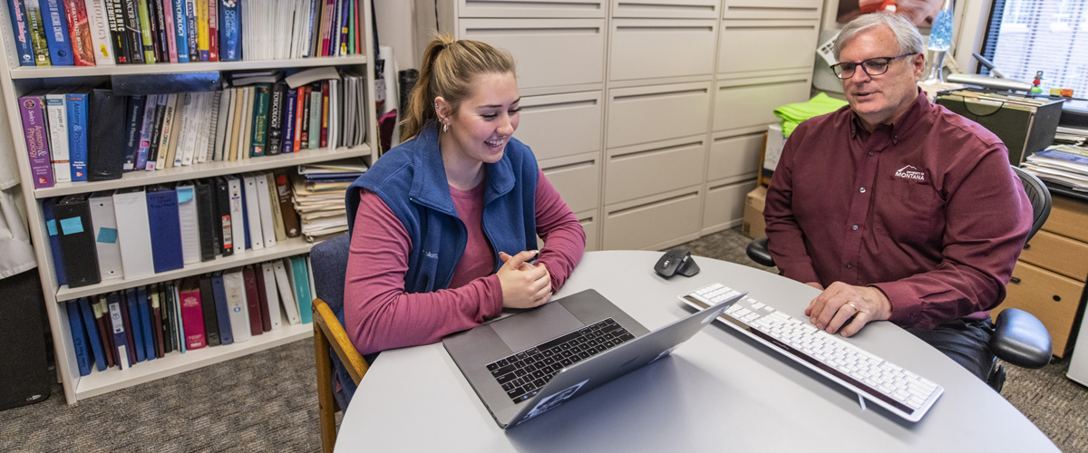 A faculty member advises a student 