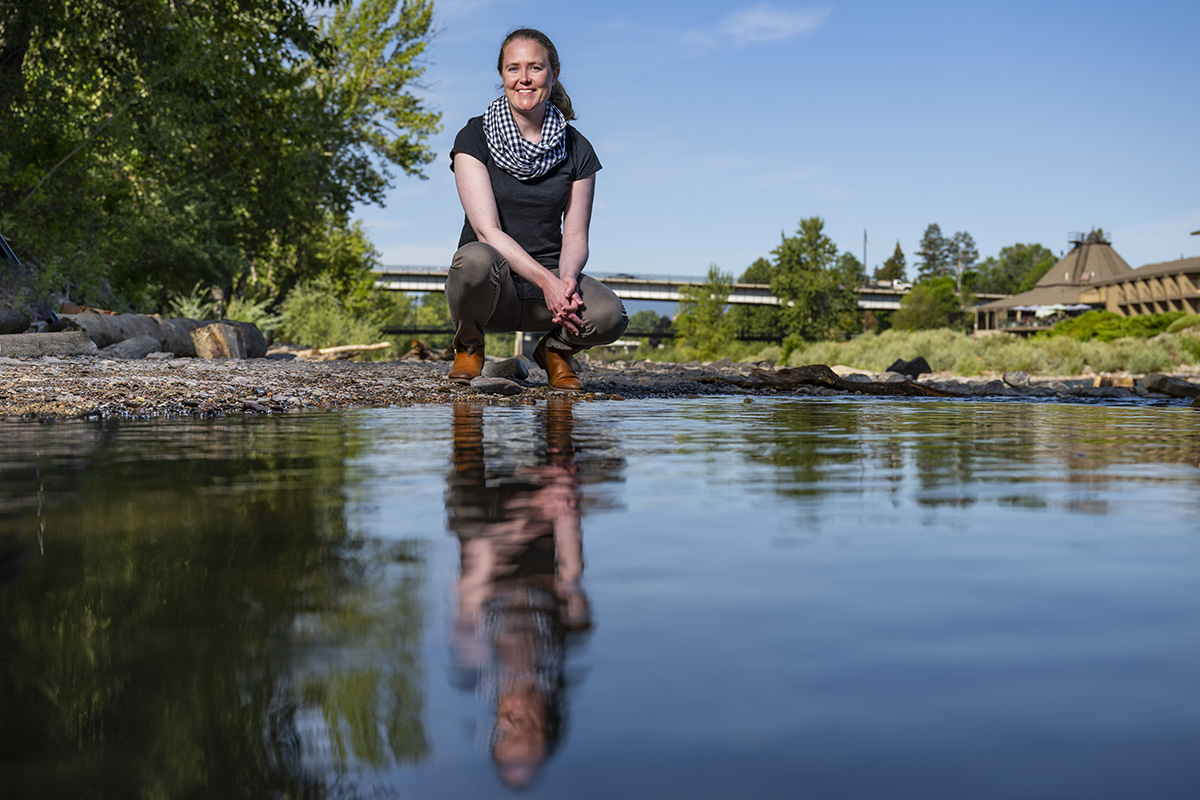 Photo of Hilary Marten standing by the Clark Fork River
