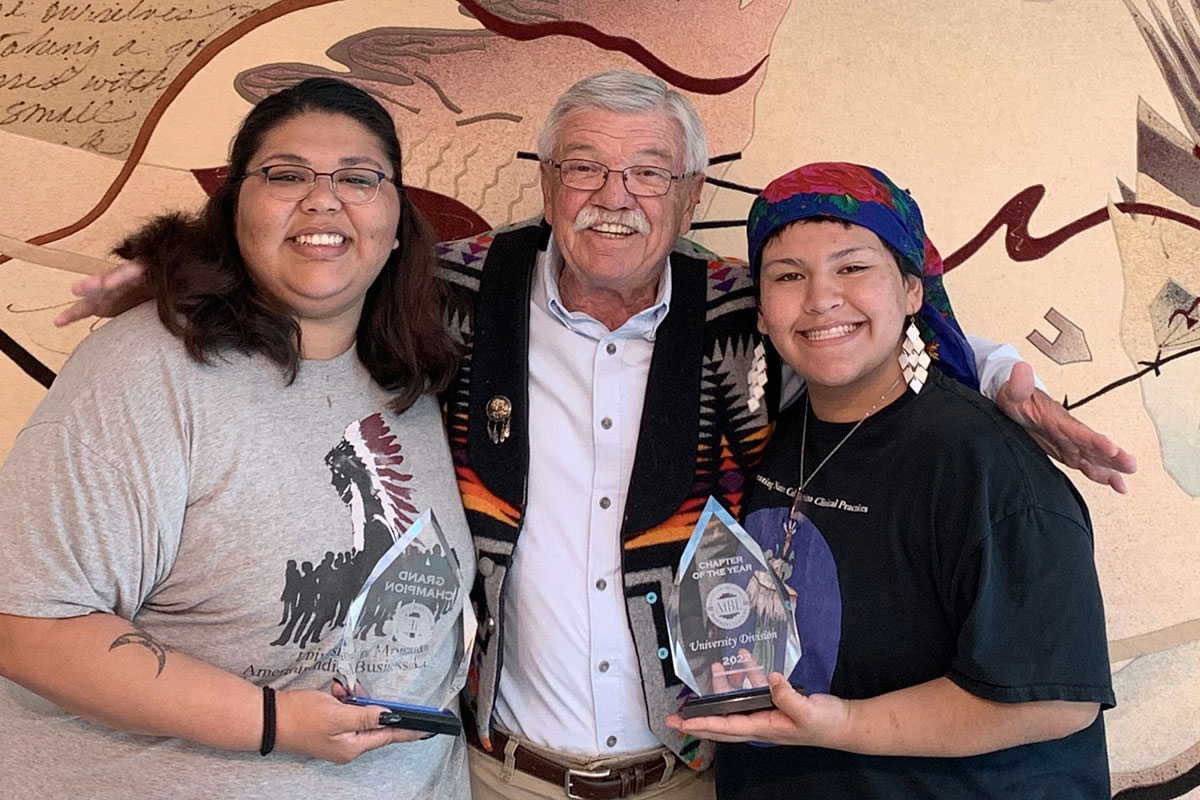 . Pictured are (left to right) chapter President Millie Bearleggins, adviser Dr. Larry Gianchetta and Vice President Omaste-win Foster.