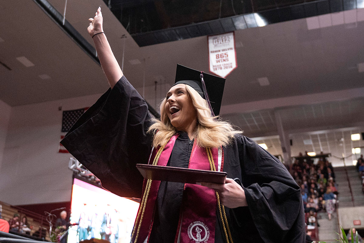 A UM student celebrates graduating. 