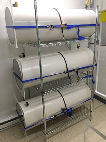 A picture of white tubes used to house research mice.