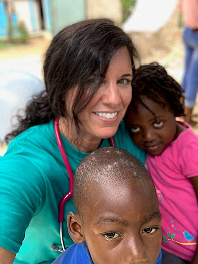 Photo of Lara Hall with children in Dominican Republic