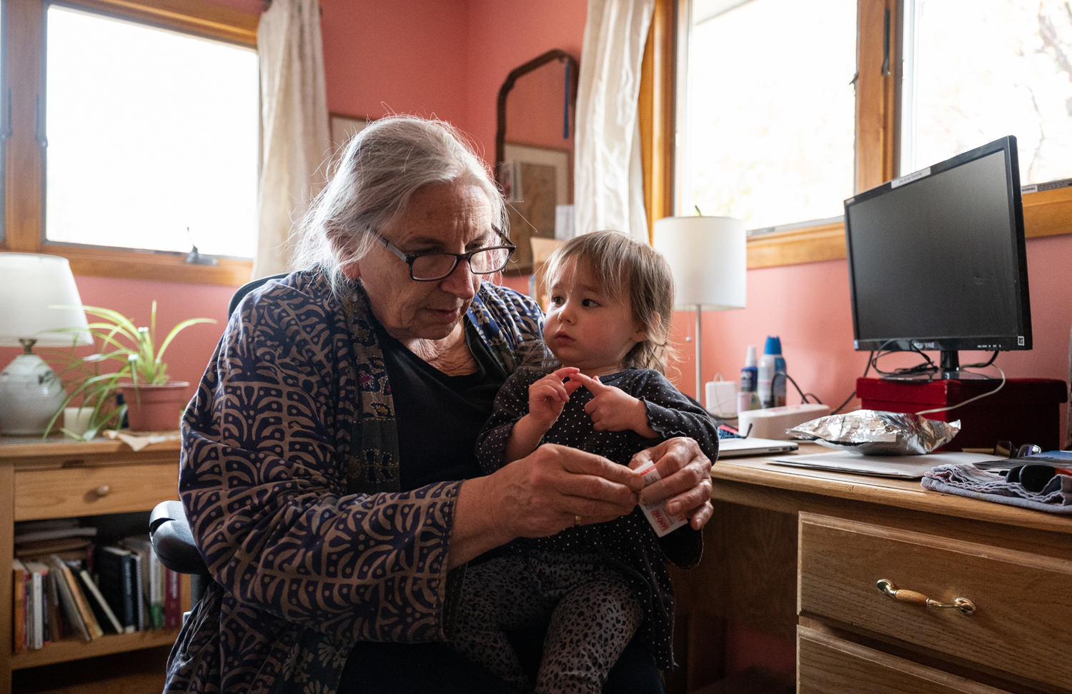 An image of Kratina holding her granddaughter.