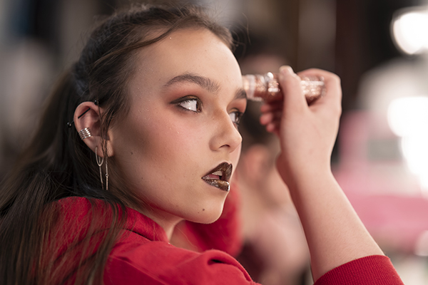 Photo of actor putting on stage makeup