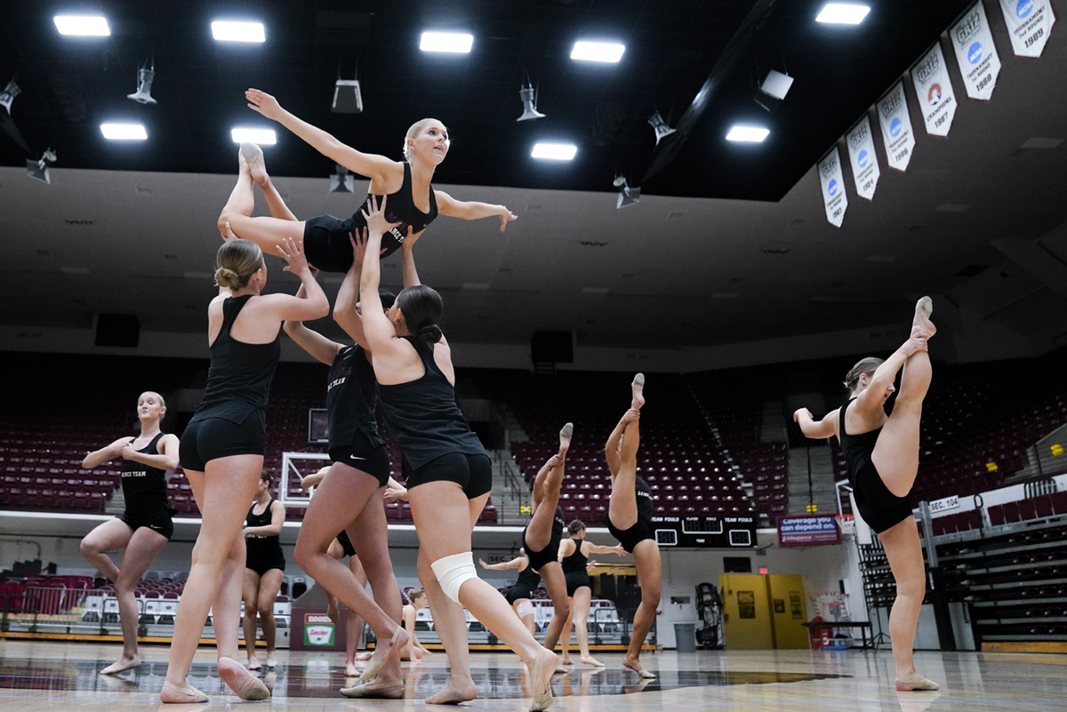 The dance team practices their routine. 