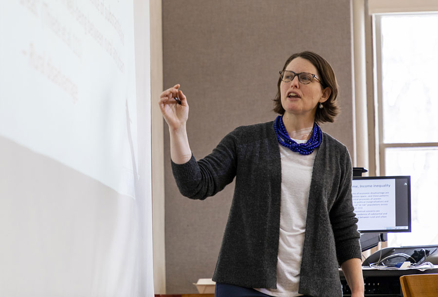A picture of Daisy Rooks teaching in a UM class.