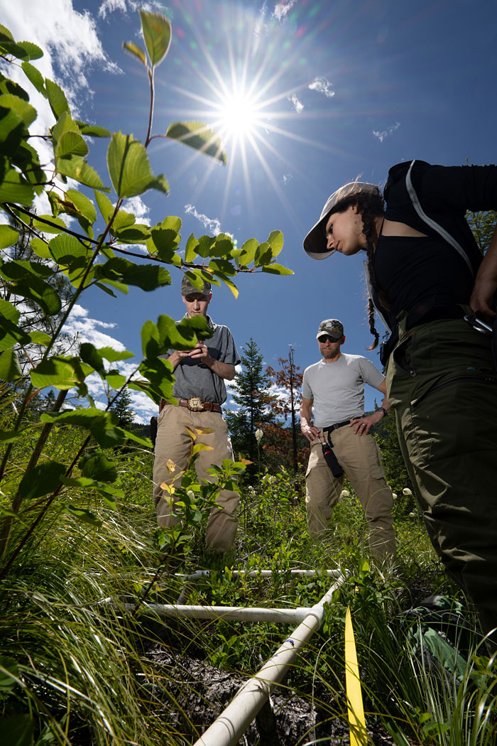 Pictured are (left to right) student Trevor Weeks, UM Wildlife Biology Program Director Chad Bishop and student Ava Window. 