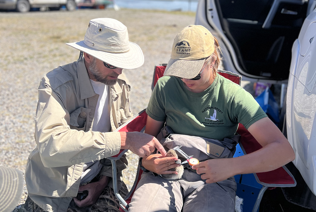 Professor Thomas Riecke works in a canoe.
