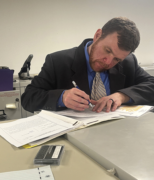 A picture of law student David Ricci working.