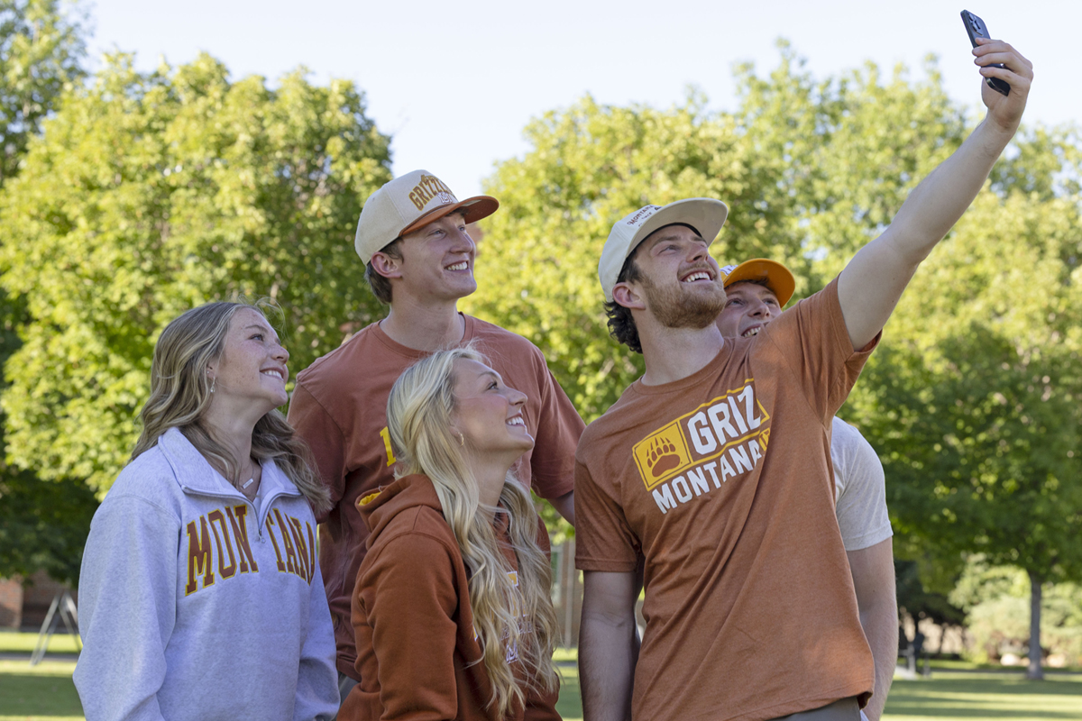 An image of people wearing the new vintage-inspired line of Griz apparel. 