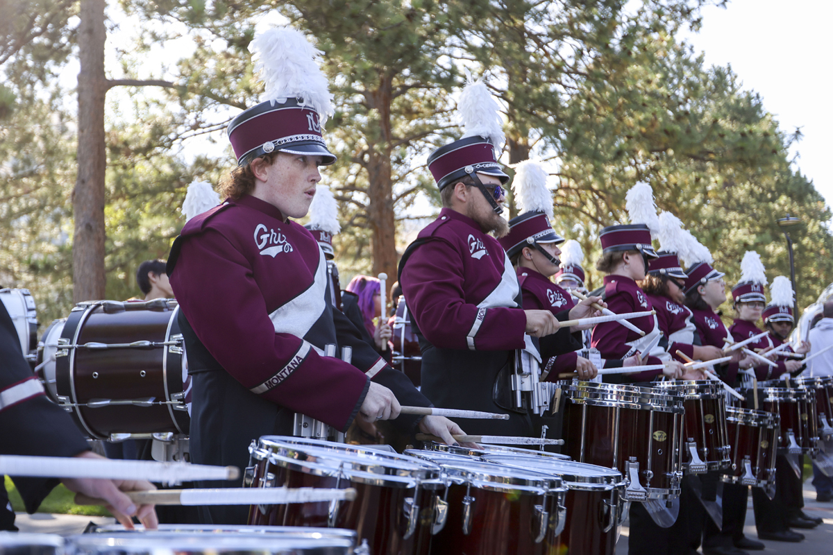 Bruso plays with other marching band students on the field. 
