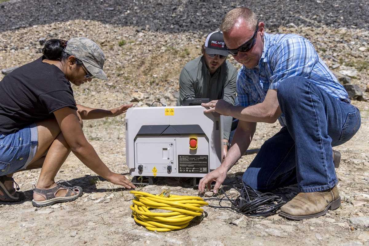 An image of Michael Kuni setting up the drone in a box. 