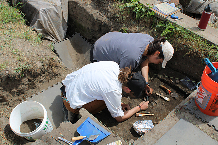 Megan Denis (white shirt) works in Housepit 54.