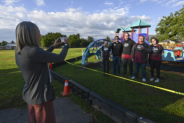 Principal Brittnie Keilman takes a picture of members of the Grizzly Esports Team.