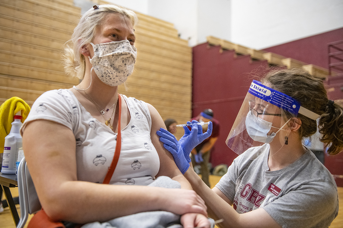 A female UM student receives the vaccine 