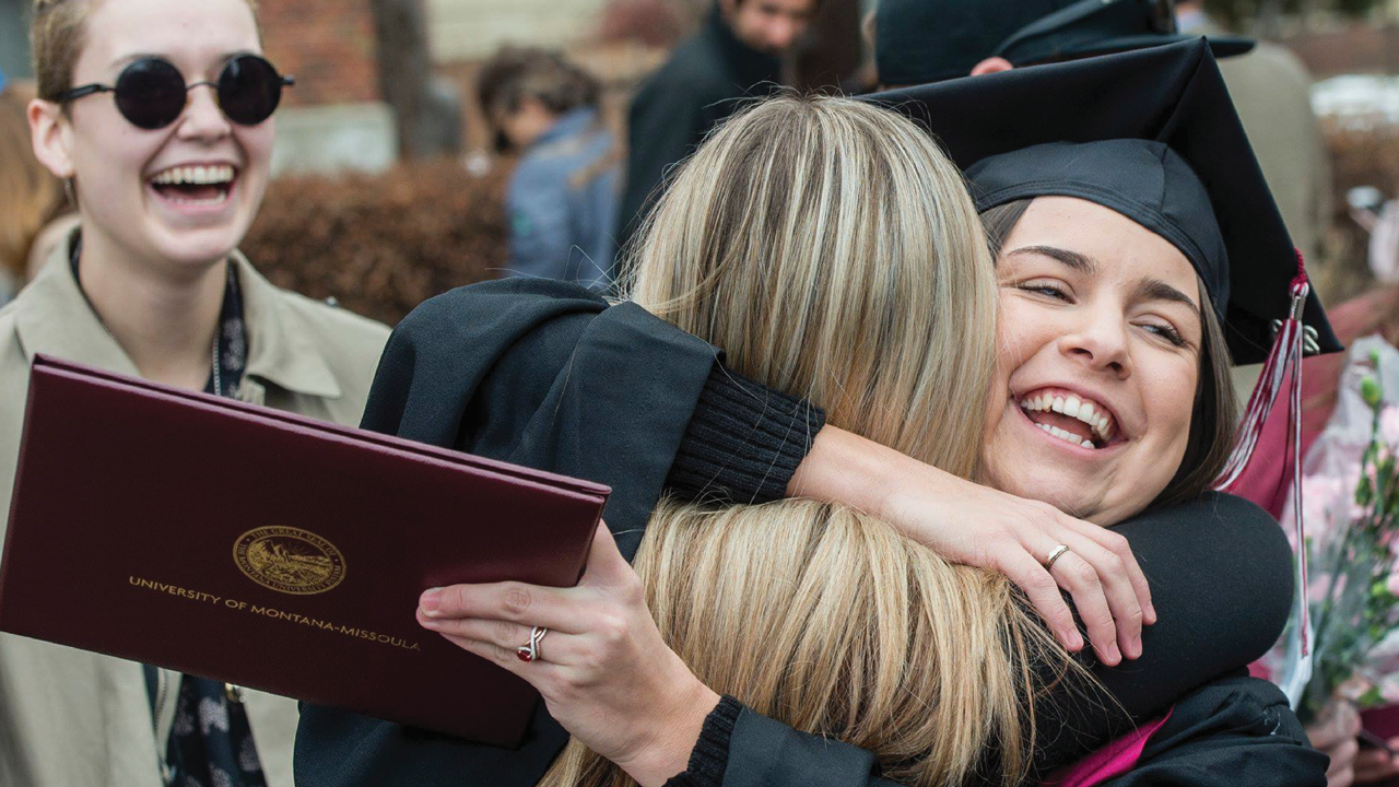 graduate celebrating