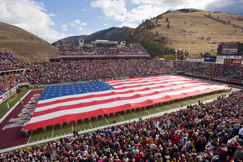 ROTC students outstretch an American flag across the entire football field of Washington Grizzly Stadium