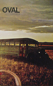 Cover of Volume 3: Rusted bus at sunset in a wheat field.