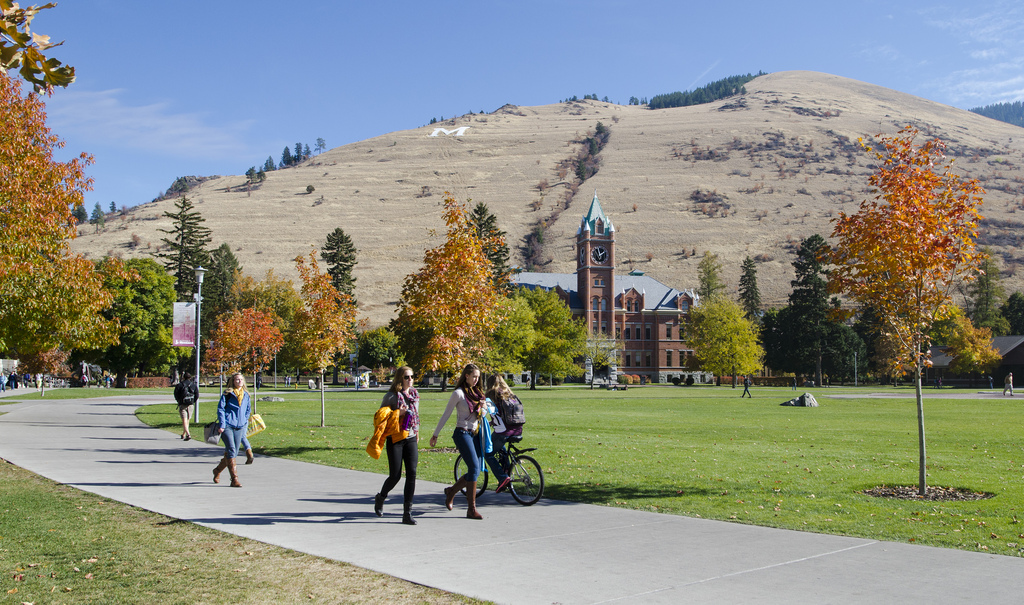 Students walking on Oval at University of Montana campus.