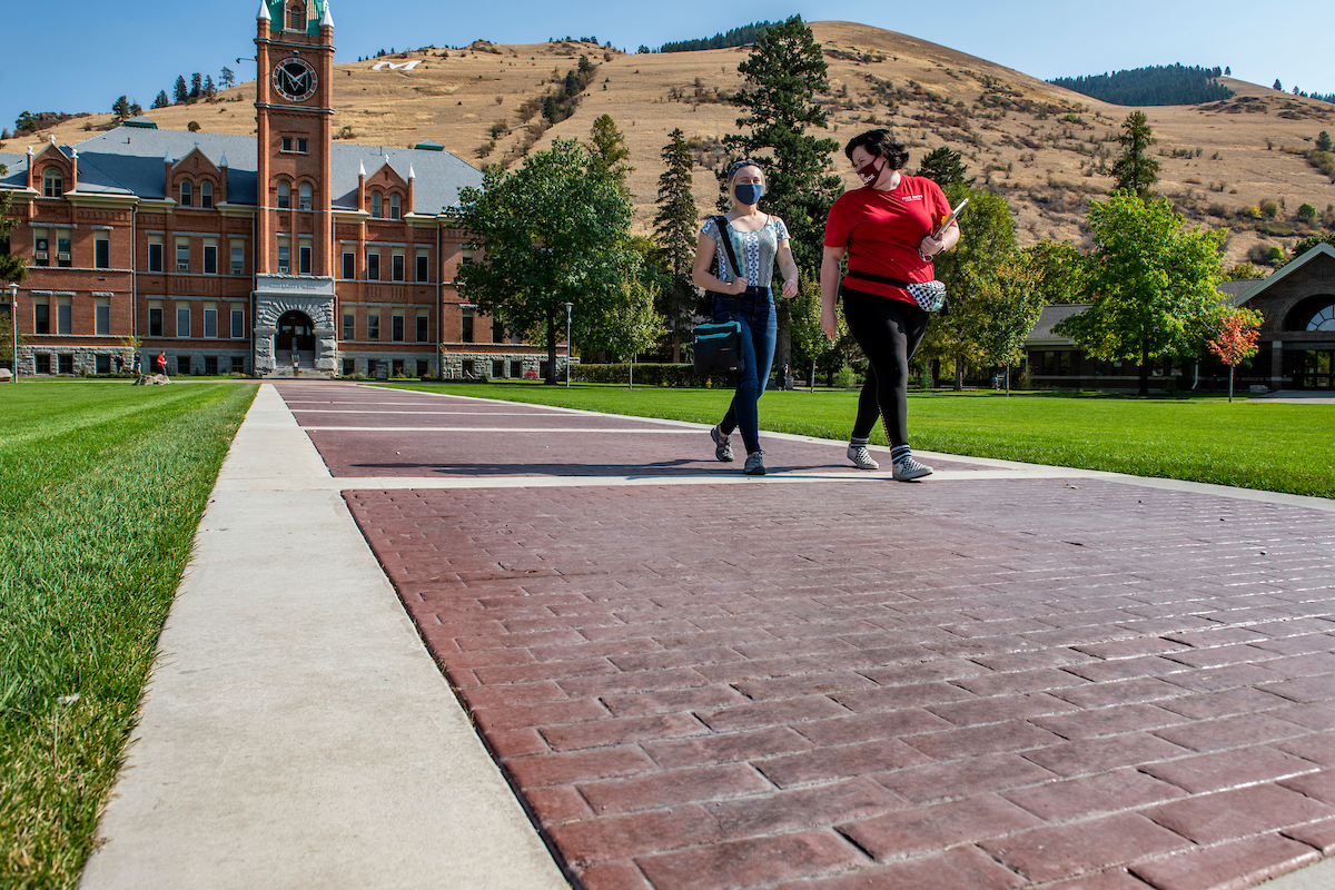 Photo of students on brick path