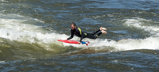 man surfing brennans wave in missoula