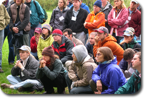 conferences participants outside in rain gear