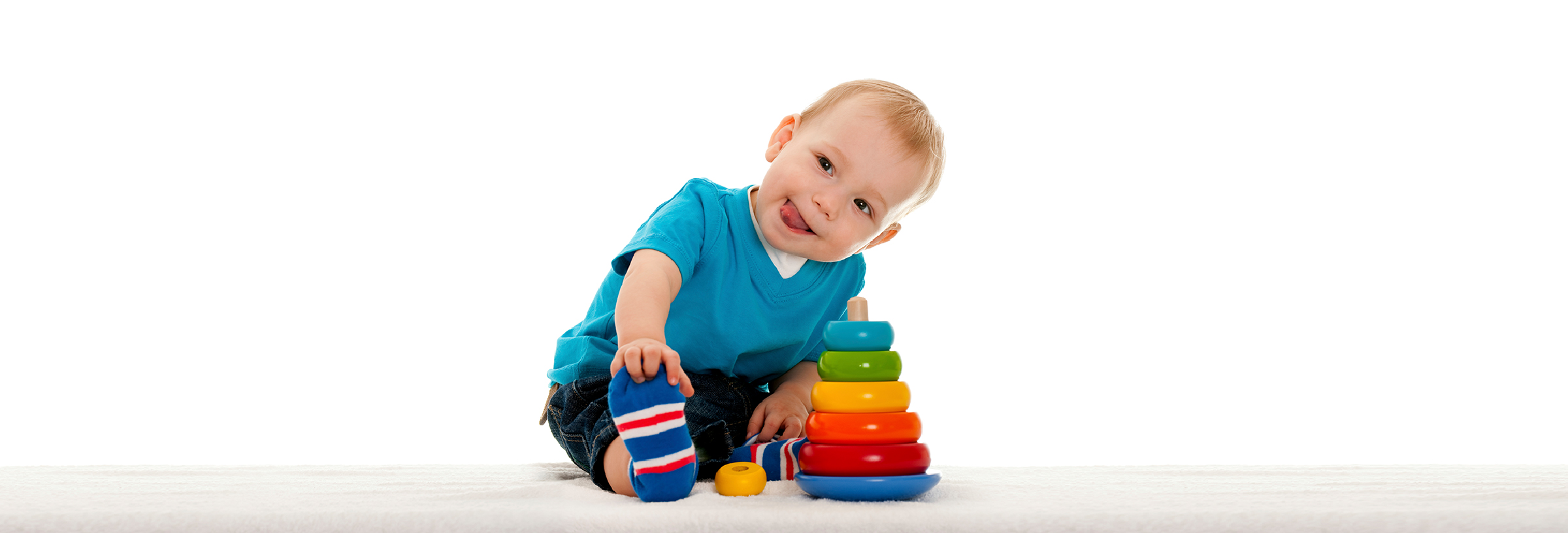 baby boy plying with toyes