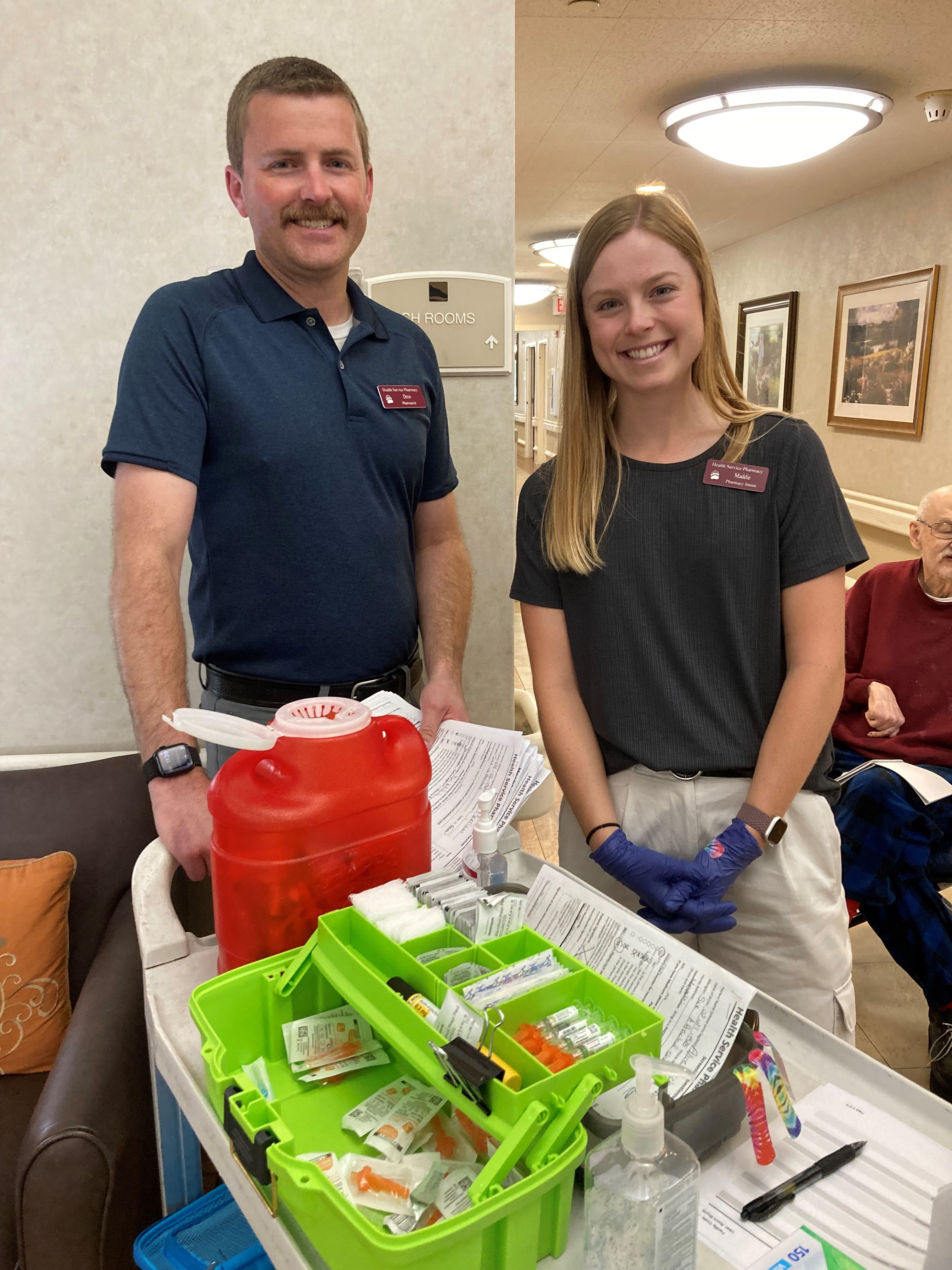 Kenneth Chatriand and Maddie Trent at thier vaccine booth