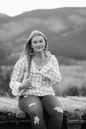 callie sits and smiles at camera