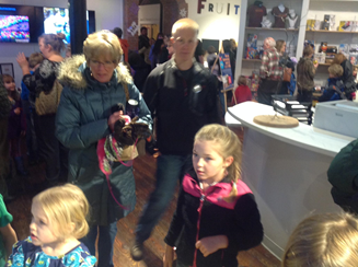 group of children and adults exploring spectrUM museum at Parade of Lights