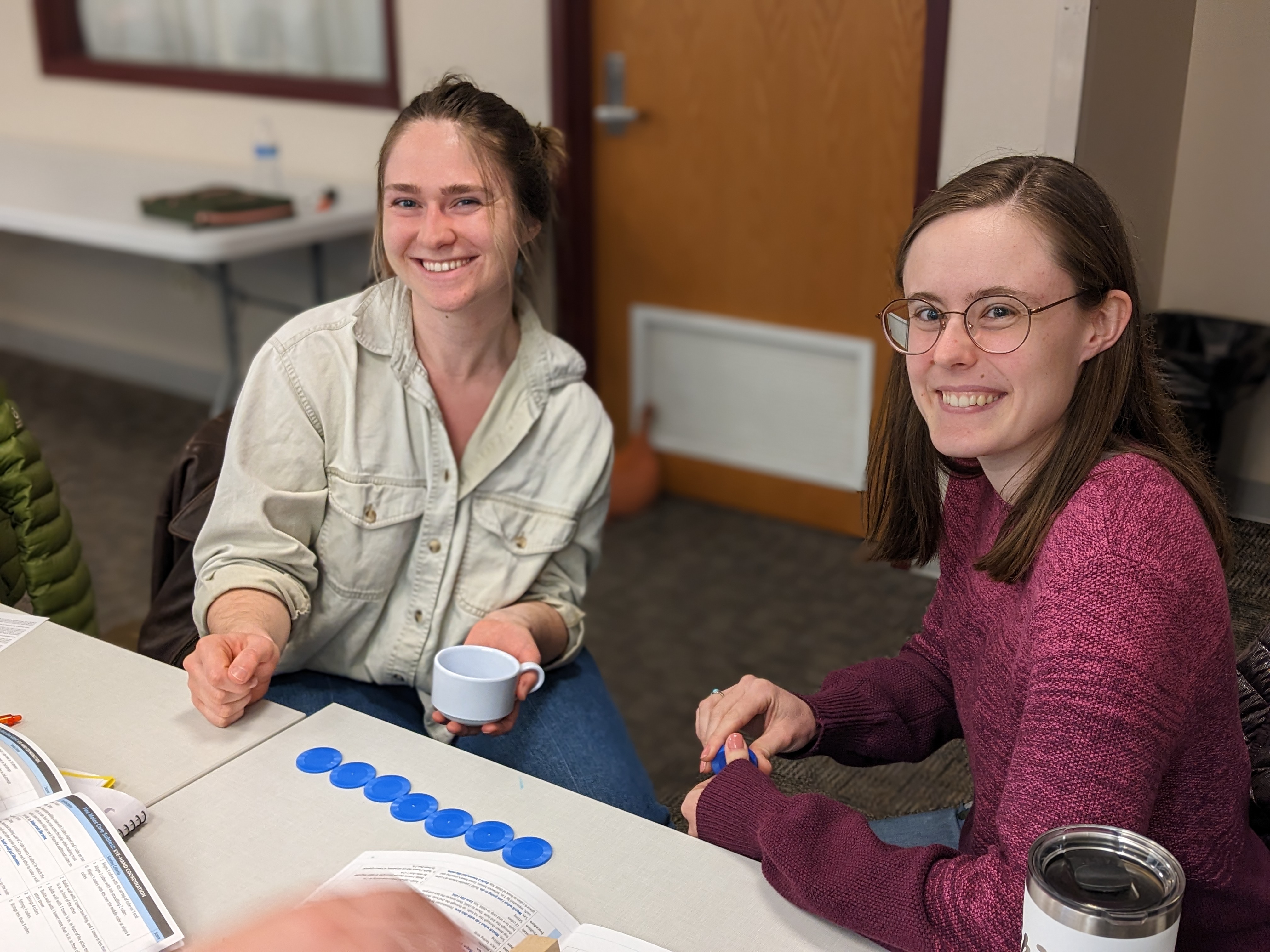 Cleo and Olivia, occupational therapy doctoral students from the Class of 2028, practice administering the Peabody Developmental Motor Scales–Third Edition (PDMS-3) during a pediatric assessment training activity in OT 545.