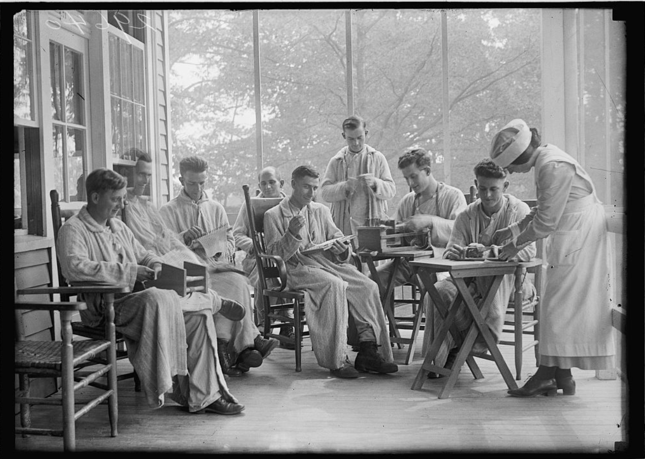 WWI veterans engage in a crafting activity with occupational therapists