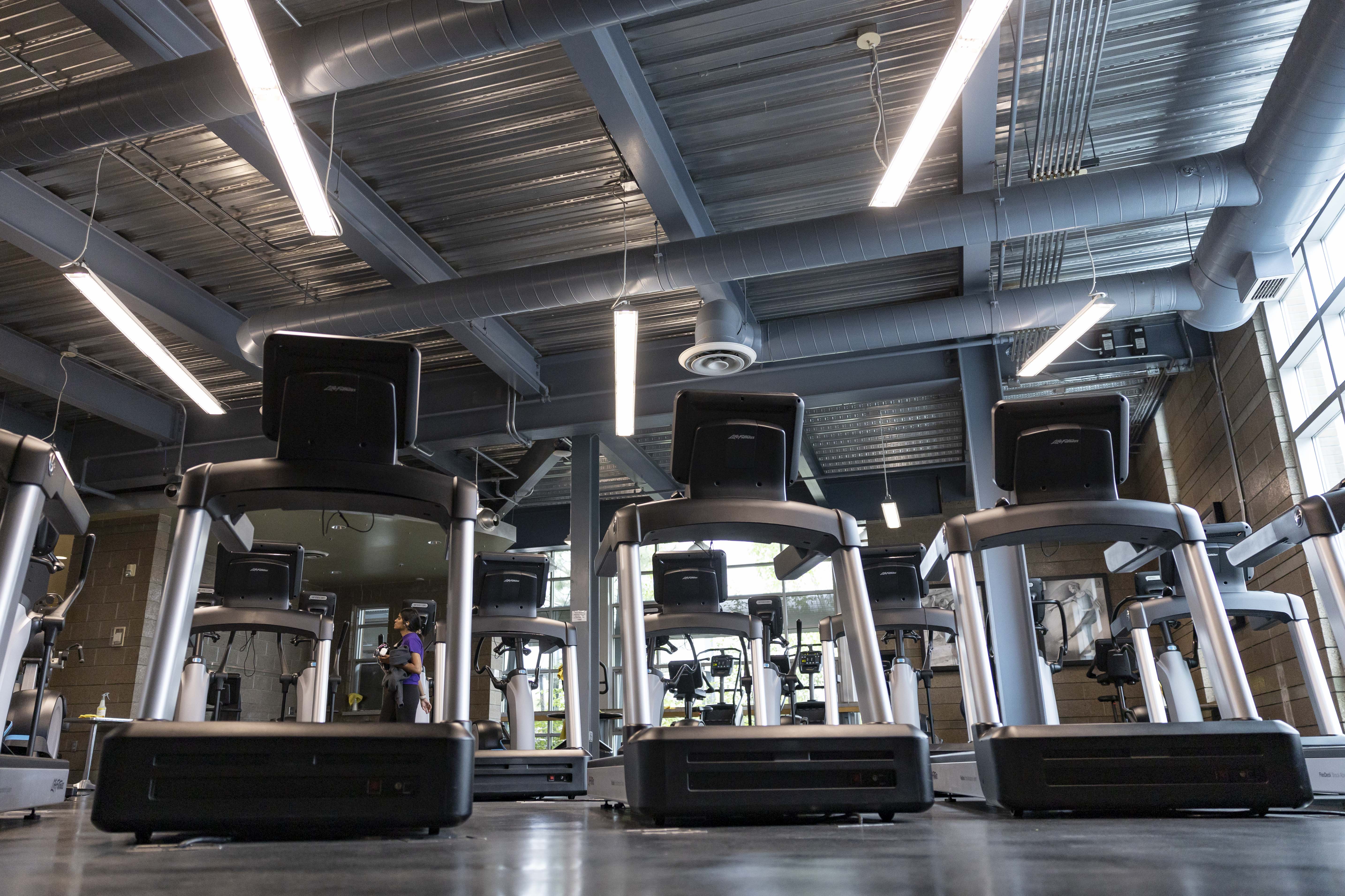 bottom up shot of campus rec treadmills and LED lighting