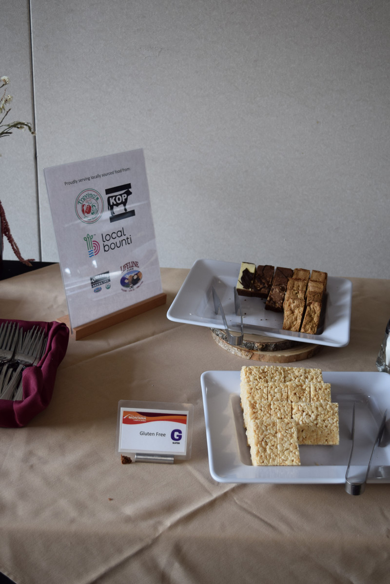 rice crispy treats and brownies with a label highlighting the food is sourced locally.