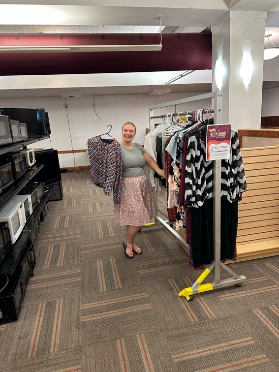 tayli poses with career closet clothing